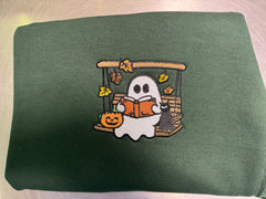 Ghost In Swing Reading On A Hunter Green Crewneck